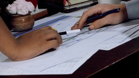 Close up of a man writing a letter, Diverse Team Discussing Charts and Financial Data Review with Colorful Graphs in Office Setting - Powered by Shutterstock - Get 15% off with code: PIKWIZARD15