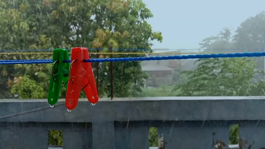 A clothes peg that was hit by raindrops
