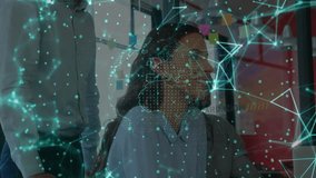 Office worker typing laptop and activating tech globe for review while peer sorting design cards. Digital innovation, collaboration, futuristic, data visualization, smart technology, professional - Powered by Shutterstock - Get 15% off with code: PIKWIZARD15