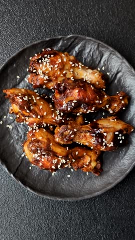 Grilled chicken wings in teriyaki sauce. Hot spicy takeaway food, fast food