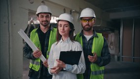 Joyful Caucasian supervisor female foreman woman posing happy men employees handymen builders repairmen smile portrait in construction happy males engineers industrial machinery work laborers building - Powered by Shutterstock - Get 15% off with code: PIKWIZARD15