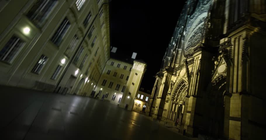 Prague St. Vitus Cathedral gothic church building at night, spinning dizzy POV camera rotate motion in the castle district