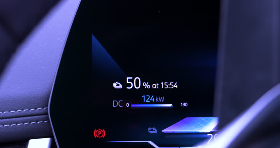 Cinematic 4K DCI video captures a zoom-out motion from digital battery screen showing 50 percent charge at 122 kilowatts to a glimpse of the full electric vehicle interior