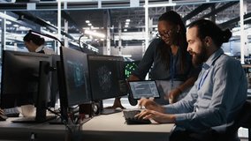 Data center system administrators working together, collaborating on neural network software development. Server hub worker and african american colleague implementing AI tech in workplace, camera A - Powered by Shutterstock - Get 15% off with code: PIKWIZARD15
