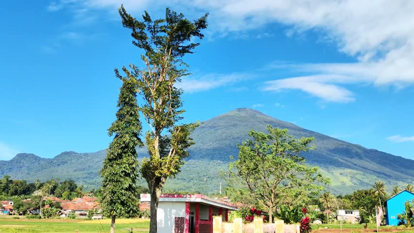 Rural footage with Mount Ciremai and residents