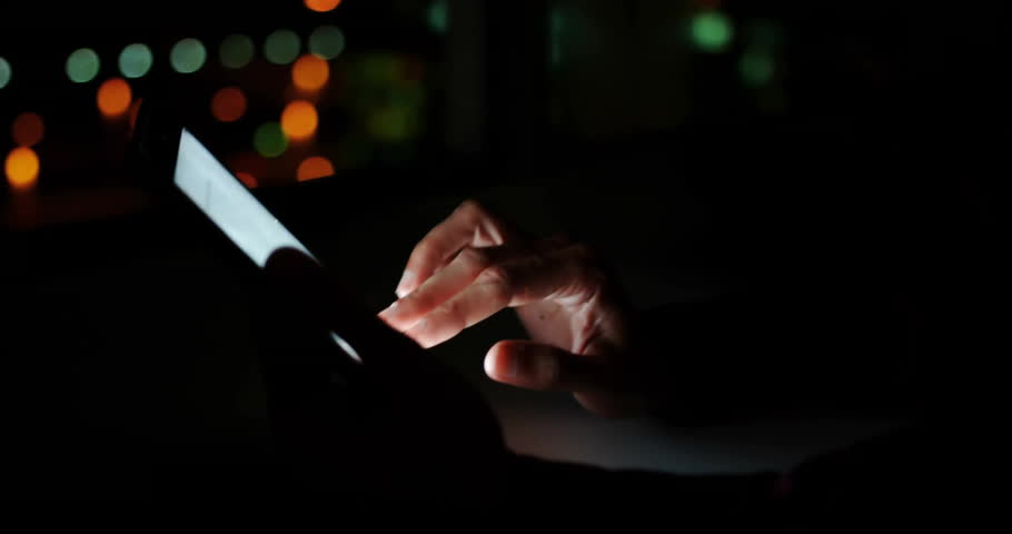 Woman tapping touchscreen at night, showing Play Subscribe Like icons boosting marketing engagement. Technology, digital, smartphone, nightlife, urban, introspection, modern
