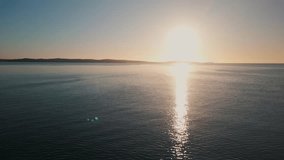 Cinematic drone shot The Rowing Team Glides Smoothly Over Halifax Bay As The Sun Rises. Captured From Above, Their Rhythm Forms Ripples Across The Quiet Surface. - Powered by Shutterstock - Get 15% off with code: PIKWIZARD15