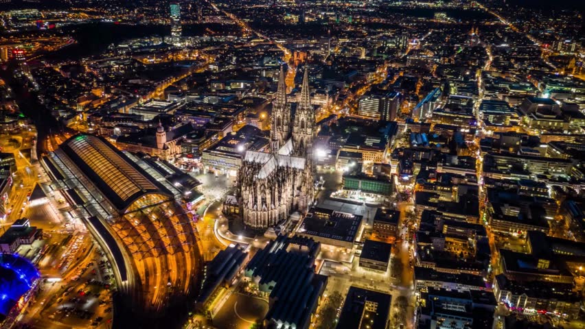Night Aerial View of Illuminated Cityscape with Roads and Buildings