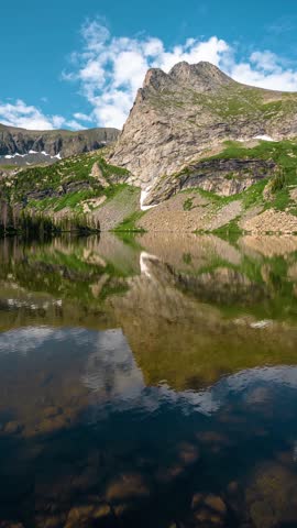 Vertical Timelapse, Pristine Alpine Lake Reflection of Mountain Peak and Clouds. Lower Sand Creek Lake, Wet Mountains Range, Colorado USA