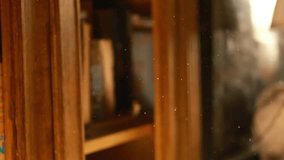 cinematic light from the window, sunset. dust and wool are flying in air, home cleaning atmosphere and allergy room interior, vintage, wooden antique bookcase - Powered by Shutterstock - Get 15% off with code: PIKWIZARD15