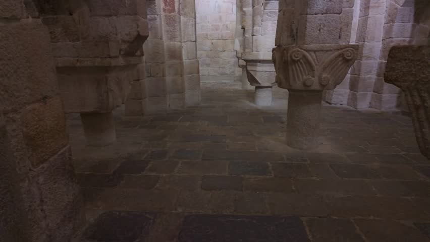 Horizontal upward panning video of the central nave in the crypt of Leyre Monastery, from stone floor to vaulted ceiling - Powered by Shutterstock - Get 15% off with code: PIKWIZARD15