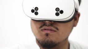 Close up of man wearing virtual reality headset, experiencing new technology, isolated on white background - Powered by Shutterstock - Get 15% off with code: PIKWIZARD15