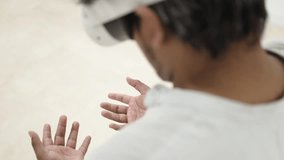 Innovative professional wearing advanced virtual reality headset, stunned by the way his hands look in imaginary scenario - Powered by Shutterstock - Get 15% off with code: PIKWIZARD15