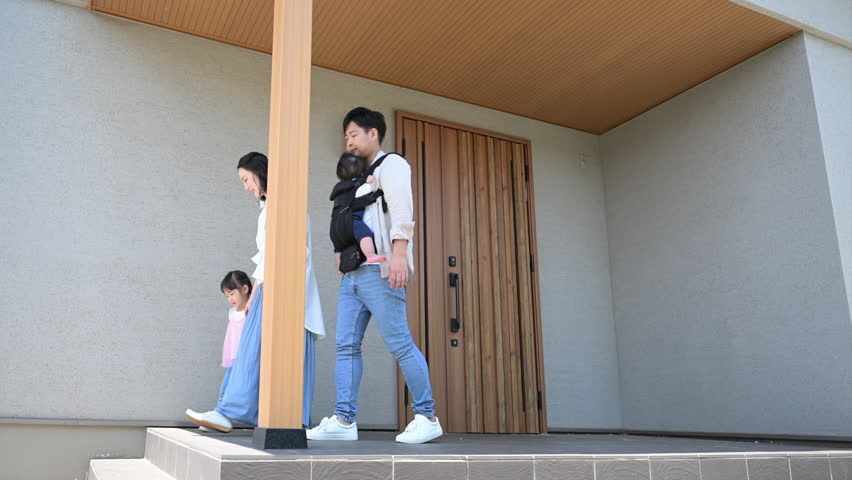 Outing scene of a Japanese family of four leaving through the front door. I'm off. Video.