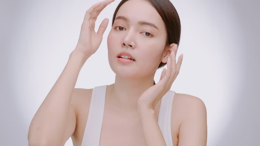 Portrait of a young Asian girl with light makeup and perfect skin. Beautiful face of young woman with natural skin.