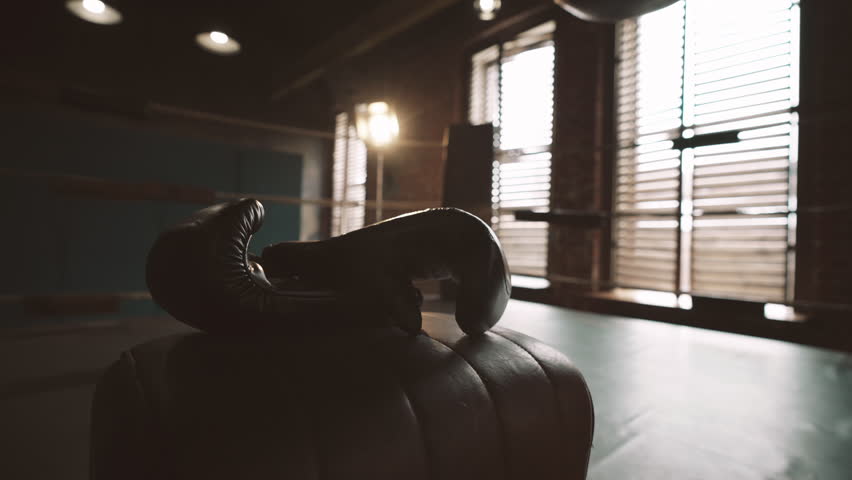 Boxing gloves and ring for workout in modern gym, do sport for stay healthy. Fight club, nobody in sport hall, active lifestyle and physical exercises for keeping fit, professional sport and hobby