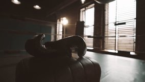 Boxing gloves and ring for workout in modern gym, do sport for stay healthy. Fight club, nobody in sport hall, active lifestyle and physical exercises for keeping fit, professional sport and hobby - Powered by Shutterstock - Get 15% off with code: PIKWIZARD15