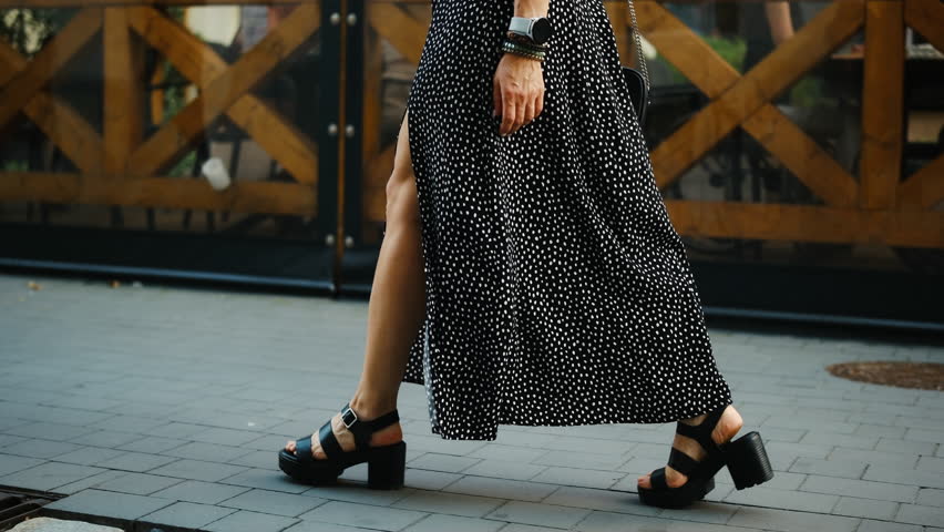 Female Feet Walking In A Historical Part Of A European City, Legs Of A Stylish Girl Strolling On A Street