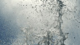Slow motion water spray pattern from blowhole forms organic arc against light ocean sky - Powered by Shutterstock - Get 15% off with code: PIKWIZARD15