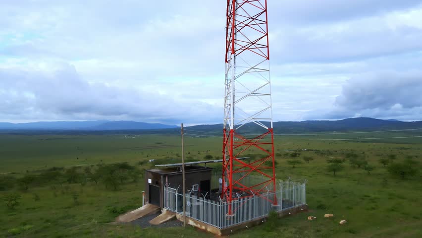 Telecommunication Tower with Solar Panels in Rural Africa: Connectivity and Renewable Energy in Nature. - Powered by Shutterstock - Get 15% off with code: PIKWIZARD15