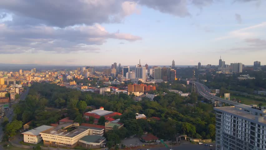 Nairobi Cityscape at Sunset. An aerial view of Nairobi, Kenya, showcasing its urban skyline during a vibrant sunset.