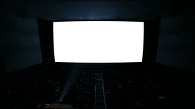 White cinema screen with projector light and audience in a modern cinema house. The most powerful shot in my cinema screen collection. Quite ready to add your video.