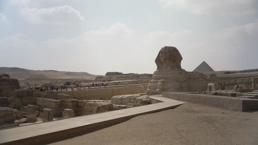 View of the Sphinx at the Pyramids of Giza on a sunny day, Giza, Cairo, Egypt, Africa