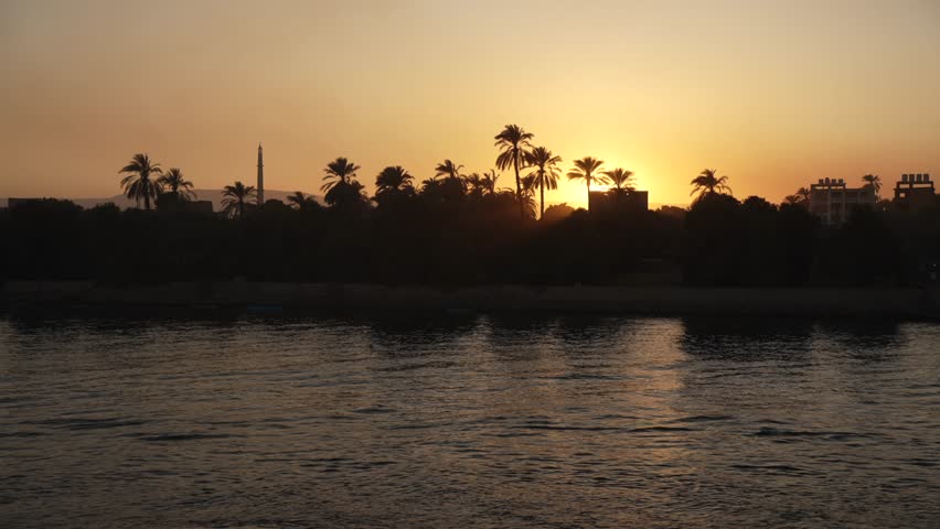 View of scenery and on the Nile River between Luxor and Edfu at sunset, Luxor, Egypt, Africa