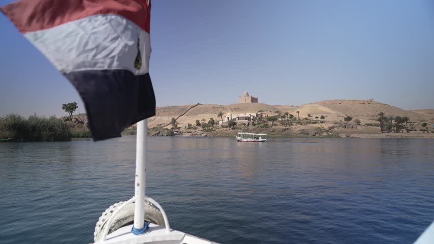 View of Aga Khan Mausoleum from small boat on the Nile in daytime, Aswan, Egypt, North Africa, Africa