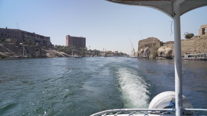 View of Aswan from small boat on the Nile in daytime, Aswan, Egypt, North Africa, Africa