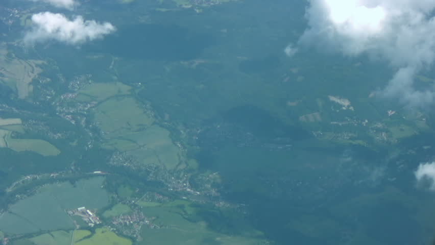 View from the airplane. A large cloud gradually closes the landscape