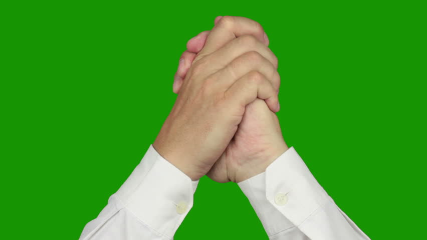 Green background (Chroma Key). Men's hands in a white shirt are showing a