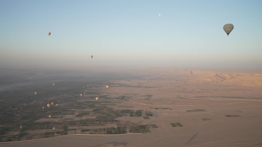 View of hot air balloons over Luxor and Nile river at sunrise, Luxor, Egypt, North Africa, Africa