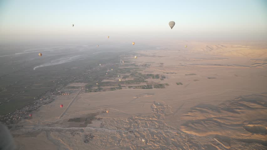 View of hot air balloons over Luxor and Nile river at sunrise, Luxor, Egypt, North Africa, Africa