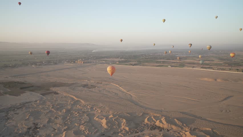 View of hot air balloons over Luxor and Nile river at sunrise, Luxor, Egypt, North Africa, Africa