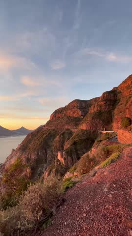 Beautiful sunrise and sunset videos of Iconic Landmarks in Cape Town, South Africa. Cape Point, Chapmans Peak reflected in pastel shades of morning and evening