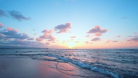 Tropical sunset and sunrise view. Light pink clouds over blue ocean. Summer beach landscape, vacation or tropical travel. Exotic scenery, soft sand and calm sea. - Powered by Shutterstock - Get 15% off with code: PIKWIZARD15