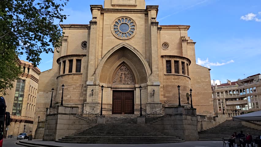 Exterior View of Saint John the Baptist Cathedral in Albacete, Castilla-La Mancha, Spain – Historic Religious Landmark under Clear Blue Sky, 4K 60fps