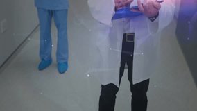 Zooming out showing doctor writing clipboard notes mapping patient data with nurse watching overlay. Hospital, healthcare, medical, professionalism, diagnostics, teamwork, digital - Powered by Shutterstock - Get 15% off with code: PIKWIZARD15