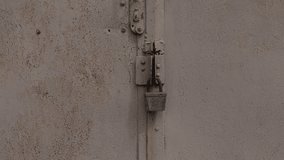 A Rusty Lock on a Metal Door Featuring Weathered Paint and Visible Signs of Age and Use - Powered by Shutterstock - Get 15% off with code: PIKWIZARD15