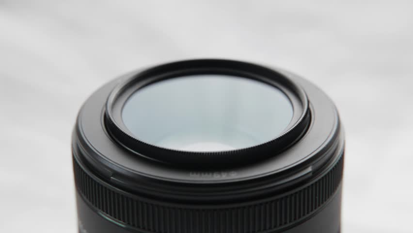Pouring Silica Gel on a camera lens optics
