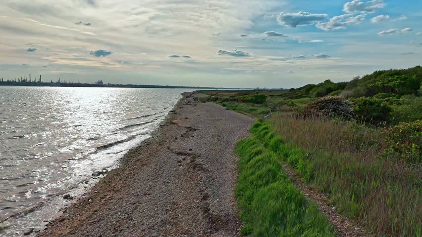 Aerial Low Angle Sea Shore Shot Slowly Panning Up