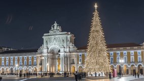Commerce Square in Lisbon illuminated at Christmas hyperlapse, with a towering tree and arch at night. Timelapse of the festive atmosphere featuring decorations and historic architecture - Powered by Shutterstock - Get 15% off with code: PIKWIZARD15