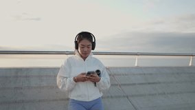 Young asian athlete relaxing using smartphone after training - Powered by Shutterstock - Get 15% off with code: PIKWIZARD15