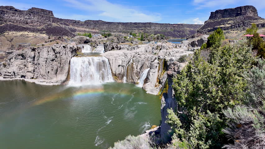 Wide panning view of Shoshone Falls in the Snake River Canyon in Idaho.
