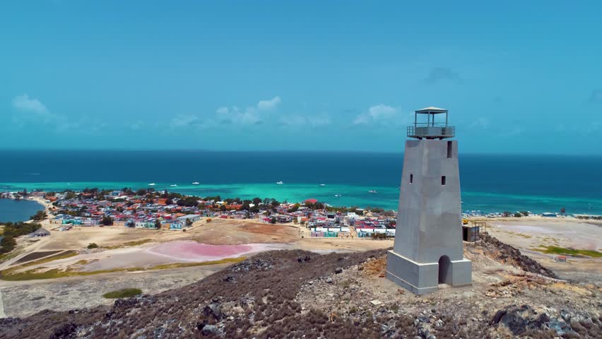 Los Roques Lighthouse In Los Roques Caracas Venezuela. Lighthouse Standing Tall On Beach With Ocean Waves Crashing. Shore Horizon Beach Sea. Remote Location Beach Scenic Coastline.