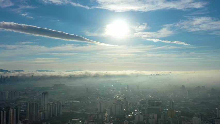 Above Clouds In Sao Paulo Brazil. Sun Shining Over Fog With Wonderful Scenery In Background. Construction Landscape Skyscrapers Busy. Construction Enterprise Town. Sao Paulo Brazil.