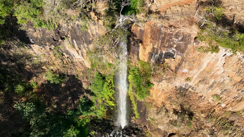 Scenic Waterfalls In Cassia Dos Coqueiros Sao Paulo Brazil. Cliffside Surrounded By Lush Green Forest Viewed From Above. Nature Clouds Sky Mountain Canyon. Nature Outdoors Waterfall Powerful Flow.