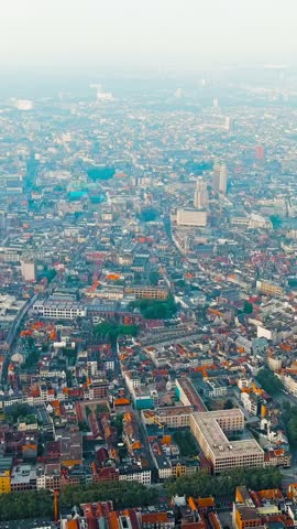 Vertical video. Antwerp, Belgium. Panorama overlooking the Cathedral of Our Lady (Antwerp). Historical center of Antwerp. City is located on the river Scheldt (Escaut). Summer morning, Aerial View. R