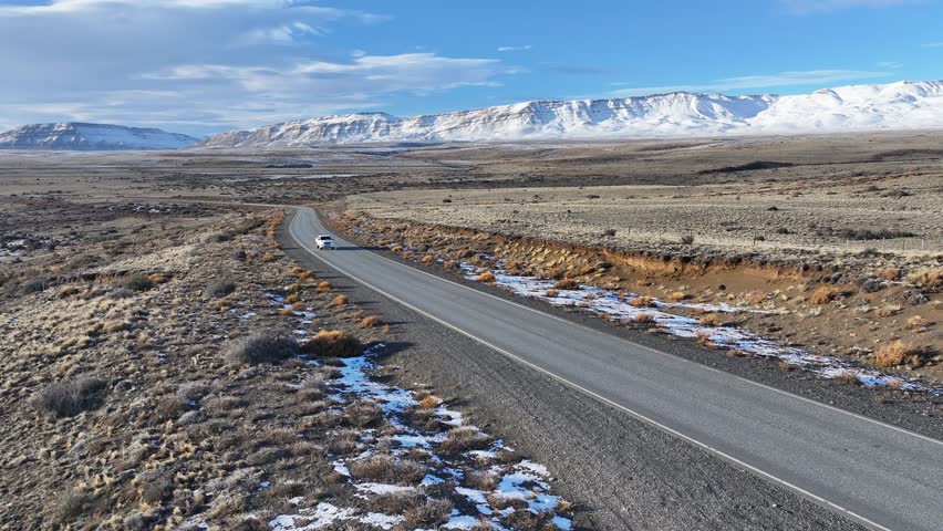 Patagonia Road In El Calafate Santa Cruz Argentina. Breathtaking Aerial View Of Busy Traffic In A Freeway Road. Nature Travel Snow Covered Forest Trees. Snow Covered Patagonia Aerial.